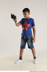 TIMBO STANDING POSE WITH GUN